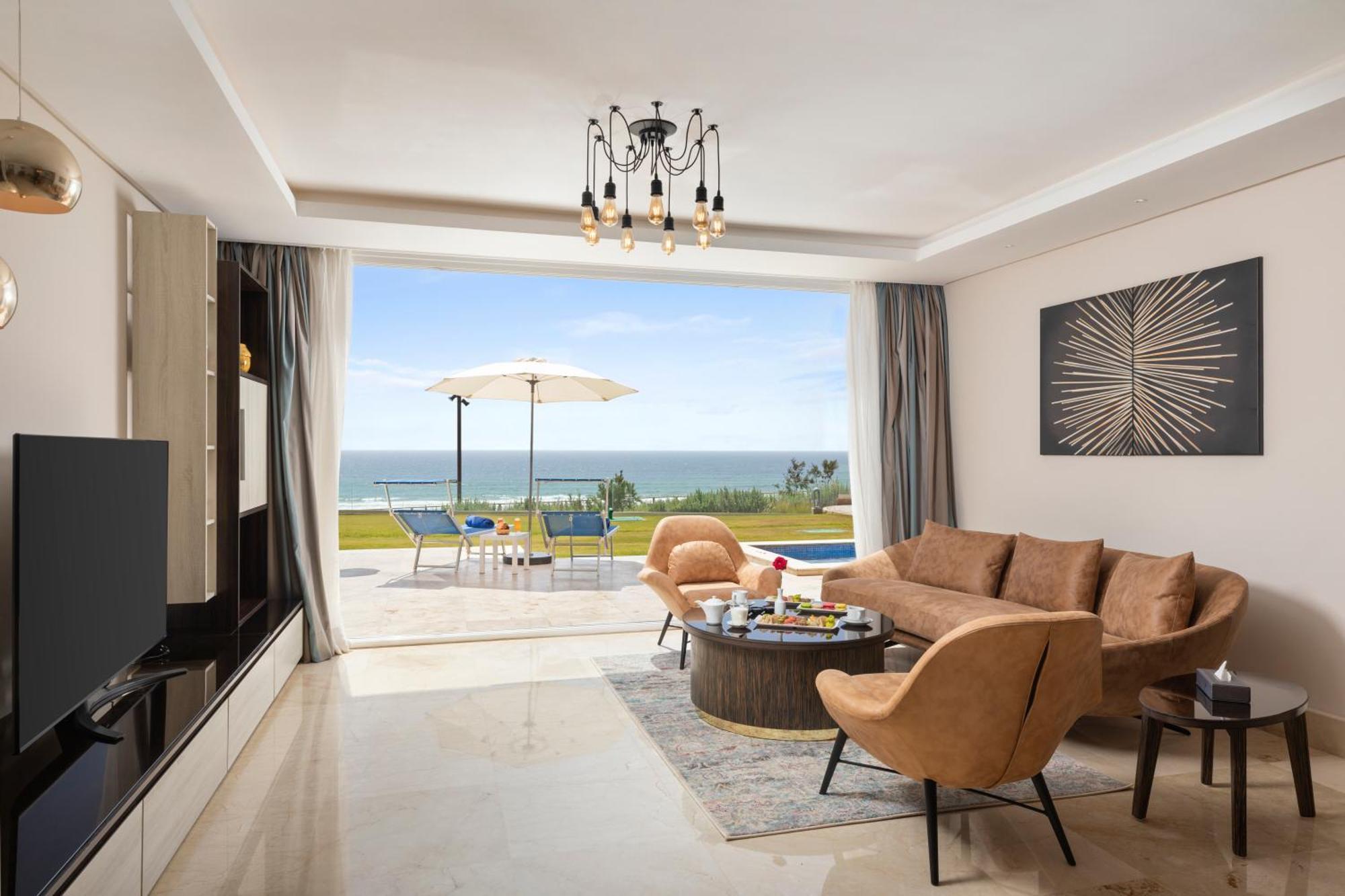 Pickalbatros White Beach Taghazout (Adults Only) Exterior photo A living room in a villa at the resort